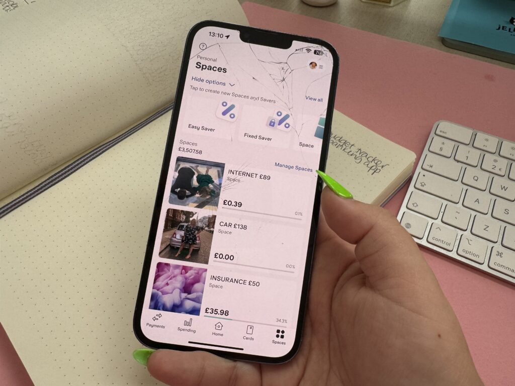 An iPhone showing the different spaces you could create on Starling Bank, such as Car, Internet, Insurance.